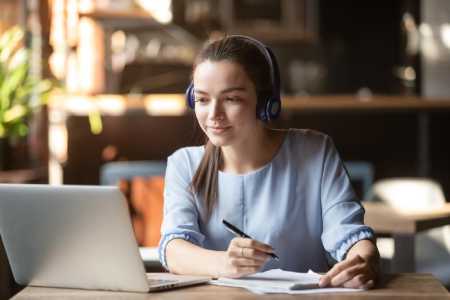 A woman working on an online course creation.